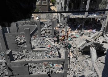 PALESTINIANS INSPECT THE RUBBLE FOLLOWING OVERNIGHT ISRAELI BOMBARDMENT AT THE NUSEIRAT REFUGEE CAMP IN THE CENTRAL GAZA STRIP ON MARCH 20, 2024. — AFP