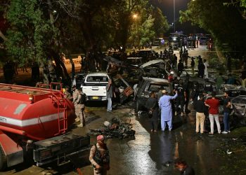 Security officials examine at the site of an explosion which occured near Karachi airport in Karachi, on late Oct 6, 2024. — AFP